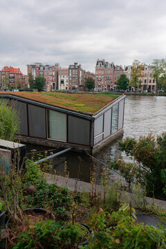 Boat house on canal in Amsterdam, alternative lifestyle 
