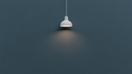 A single pendant lamp hangs from the ceiling, softly illuminating a dark textured wall in a minimalist setting.