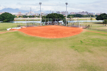 Urban Baseball Diamond with Mountain City Backdrop View