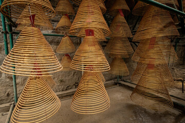 Spiral hanging insence burning in the chinese temple in Macau. Translation: Buddhist temple