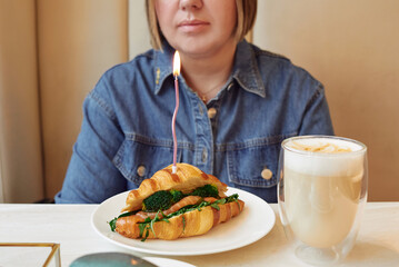 Woman celebrating her 40th birthday with a breakfast