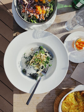 Typical swiss dishes on alfresco restaurant table