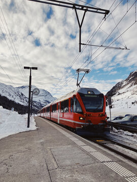 Red bernina train at mountain station