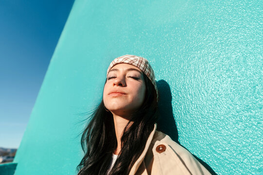Relaxed young woman with eyes closed portrait