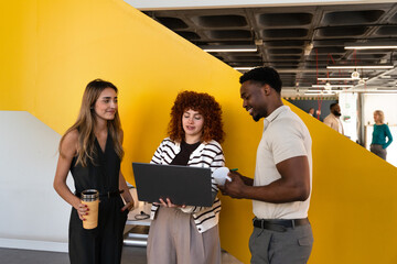 Collaborative team meeting in modern office with vibrant decor