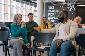 Audience engaging in an interactive workshop session