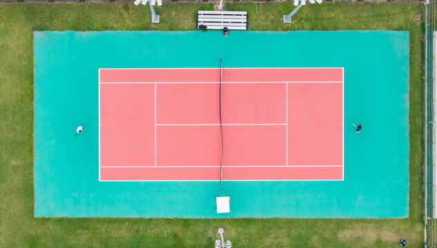 Aerial View of Tennis Court and Players in Action