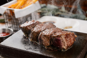 Beef steak on a hot stone plate
