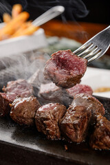Beef steak on a hot stone plate
