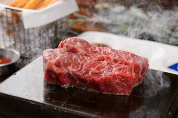 Beef steak on a hot stone plate
