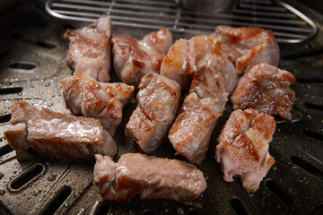 The pork is being grilled.
