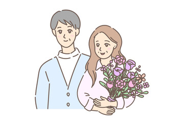 大きな花束を抱えて歩く幸せそうな初老の素敵なカップル（背景なし）