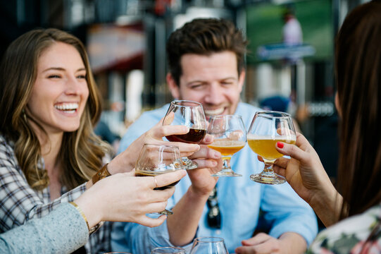 Friends toast with beers