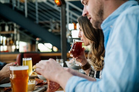 Woman tasting her beer