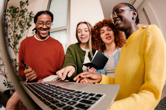 Angled shot of a happy working group sharing a brainstorming session