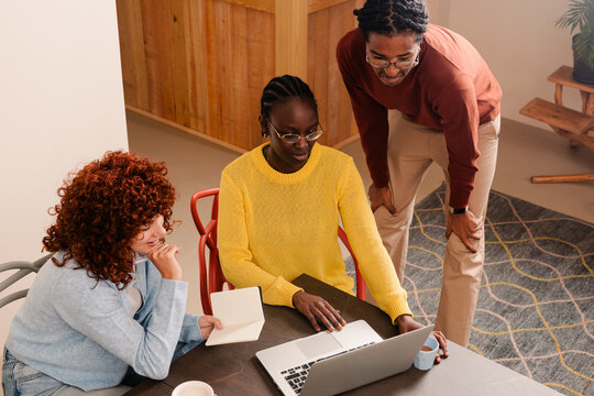 Co-workers attend an express sales presentation on a laptop screen