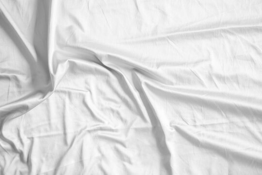 Abstract white wrinkled bedding sheet fabric texture background