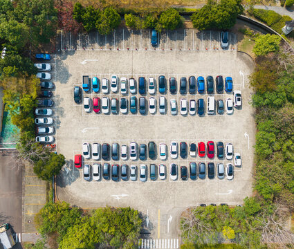 Aerial View of Organized Parking Lot with Full Car Spaces