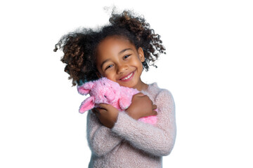 Happy african child holding pink plush toy with joyful expression, cut out