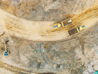 Aerial View of Construction Trucks on Dirt Road