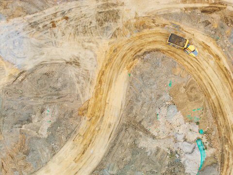 Aerial View of Dump Truck on Winding Mining Road