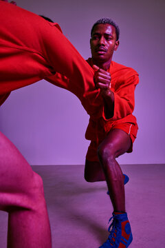 Mixed martial arts training session in vibrant studio setting