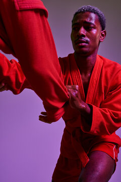 Sambo training session in vibrant studio environment