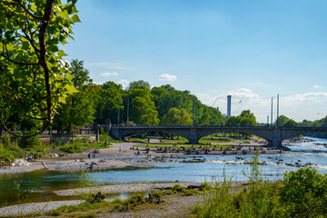 Fototapeta premium View of gravel banks of the Isar and the Maximilian Bridge in Munich, Bavaria, Germany