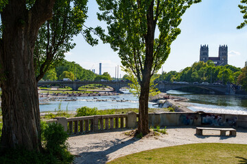 View of the Isar River, the Maximilian Bridge, and St. Maximilian Church in the Glockenbachviertel,...