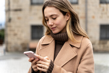 Young woman using smartphone