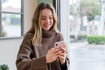 woman using mobile phone in cafe