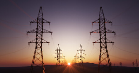 Huge power lines in a open landscape with a sunset 
