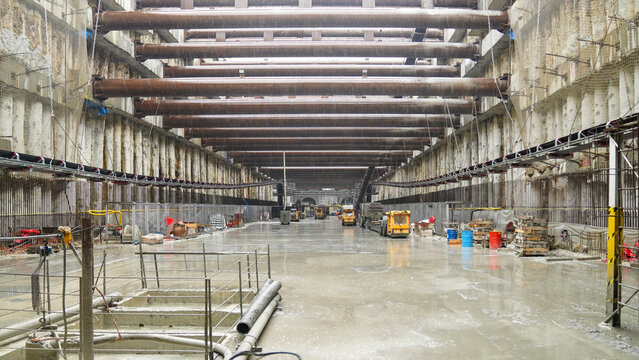 Industrial tunnel under construction with structural beams.