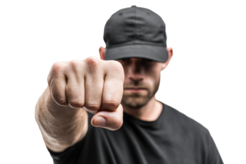 Caucasian male adult in black cap and t-shirt showing fist with determined expression, cut out
