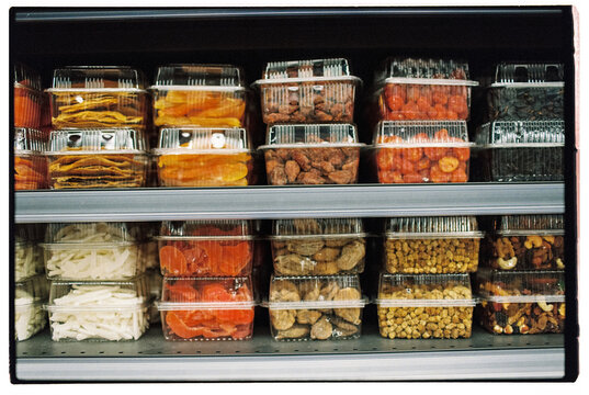 Shelves with rows of dried fruit and nuts at the local market