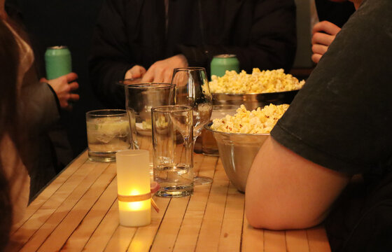 People gathering with beer and pop-corn