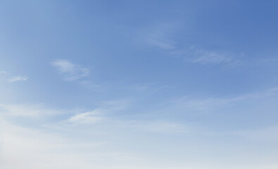 Blue sky with soft white clouds creating a peaceful and airy atmosphere. luxury sky photos for landscape backgrounds and wallpapers.