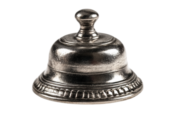 Antique silver service bell with ornate detailing on black background, cut out