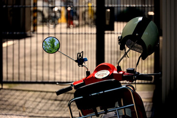 Everyday scenes in Japan   A red scooter parked in an alley