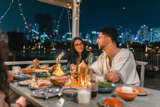 Young man and woma having Iftar Dinner During Ramadan