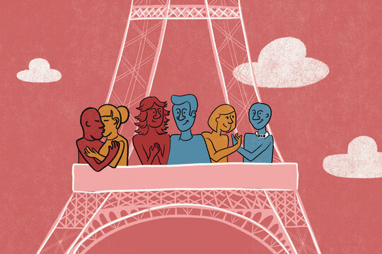 Romantic couples climb the Eiffel tower, Paris. 