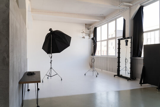 Empty Photo Studio with Lighting Equipment