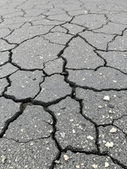 Obraz premium Old cracked grungy asphalt road background