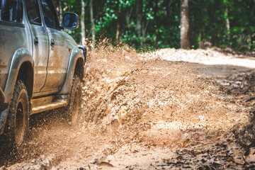  Offroad car. 4x4 off-road suv car stuck in mud. Adventure travel concept background.