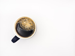 Hot black americano coffee in cup isolated on white background. Flat lay. Top view, copy space.