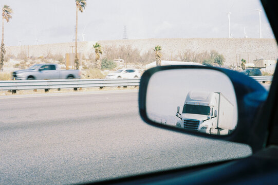 Truck on Highway Reflected in Car Side Mirror in California 