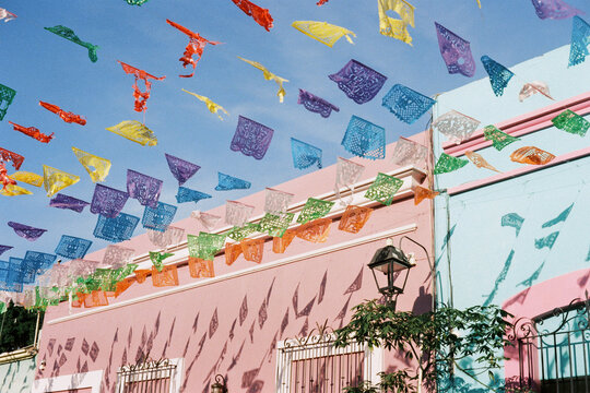 Colorful papel picado decorations in vibrant setting in Oaxaca