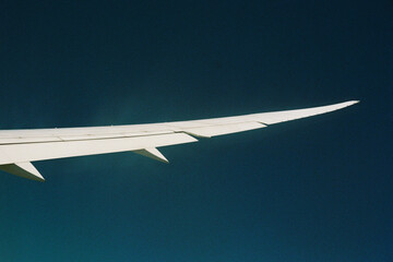 View from an airplane wing over the ocean