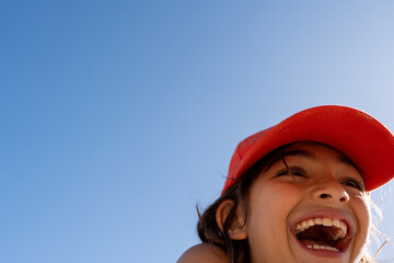 A boy smiling in the right corner of the photo.