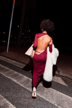 Elegant woman with fashionable dress at night